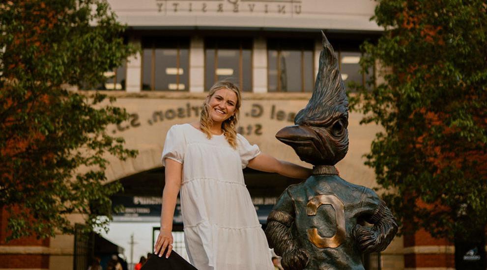 Clara Korensky by Billy Bluejay statue.